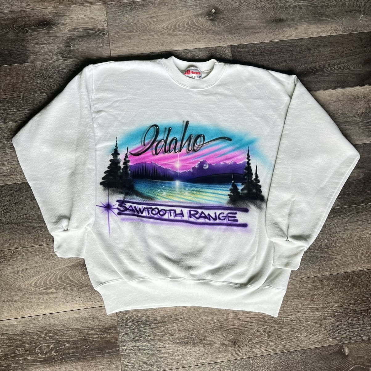 Vintage 1990s Idaho Sawtooth Range Airbrush Graphic Crewneck Shirt Hoodie Sweatshirt | PrintMintTees.com