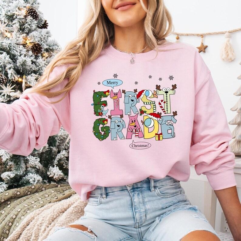 1st Grade Teacher Christmas Sweatshirt, Elephant And Piggie Christmas T-shirt, Santa's Favorite Teacher Shirt, First...