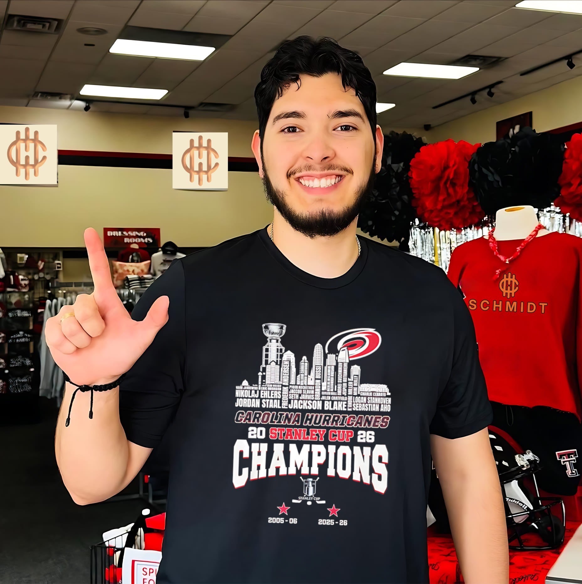 Carolina Hurricanes 2026 Stanley Cup Champions trophy alongside city skyline shirt