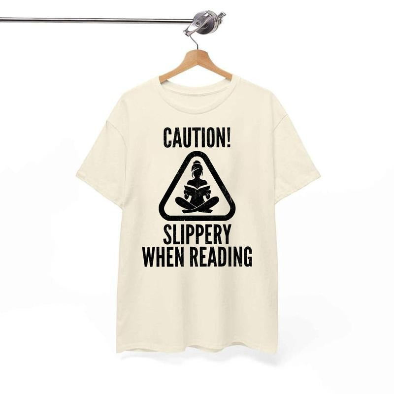 Caution Slippery When Reading Funny Smut Reader Spicy Smutty Book Lover Shirt Bookish Booktok Warning Sign Her T-Shirts, Hoodie, Sweatshirt