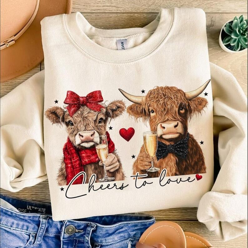 Cheers to love Highland Cow Valentine  Sweatshirt ,Coquette,Trending ,Girly Valentine Shirt Hoodie | PrintMintTees.com