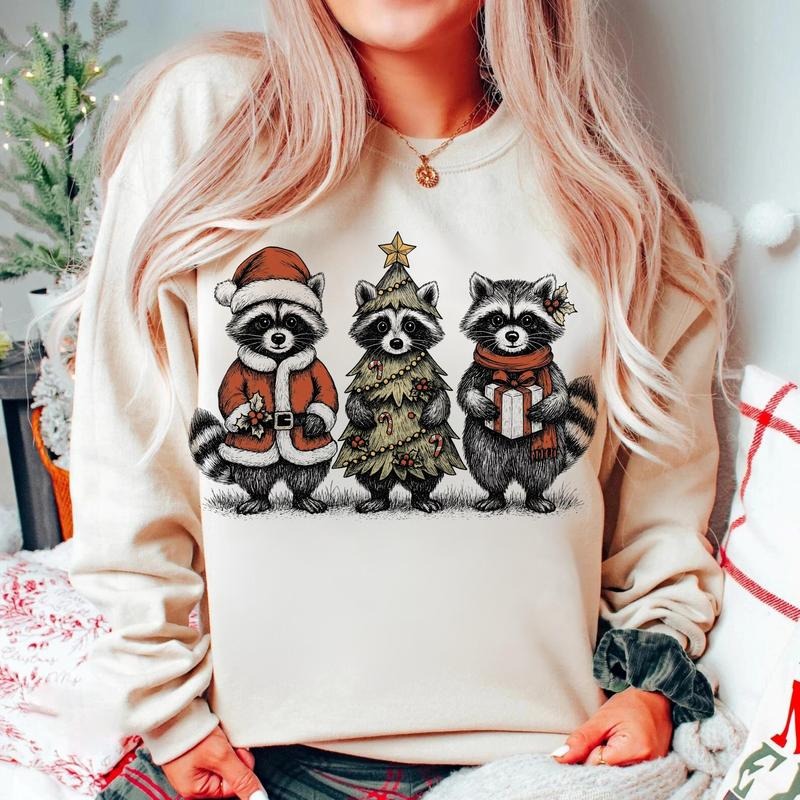[Christmas Unisex Shirt] Christmas Raccoon Sweatshirt, Cute Holiday Animal Sweater, Funny Santa and Gift Raccoon...
