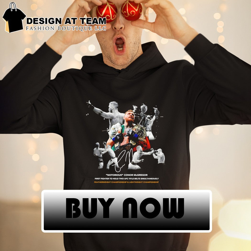 Conor Mcgregor Notorious first fighter to hold two ufc title belts simultaneously signature shirt