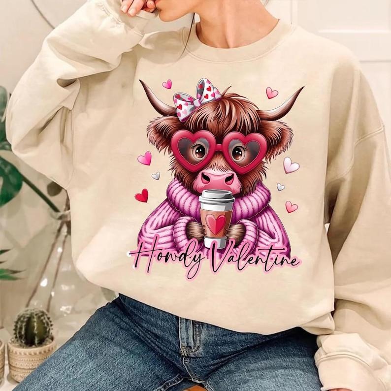 Cute Coquette Heart Sweatshirt | Retro Valentine Highland Cow | Crafts Love Crewneck Shirt Hoodie | PrintMintTees.com