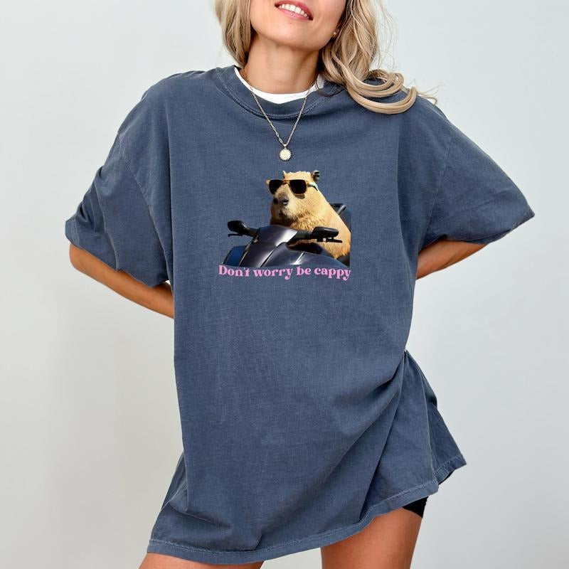 Don'T Worry Be Cappy Shirt Funny Capybara Happy Quotes Printed Cotton Fabric Minimalist Capybara Comfort Shirt Casual Her Casual Short Sleeve Shirt Cotton Fabric T-Shirts, Hoodie, Sweatshirt