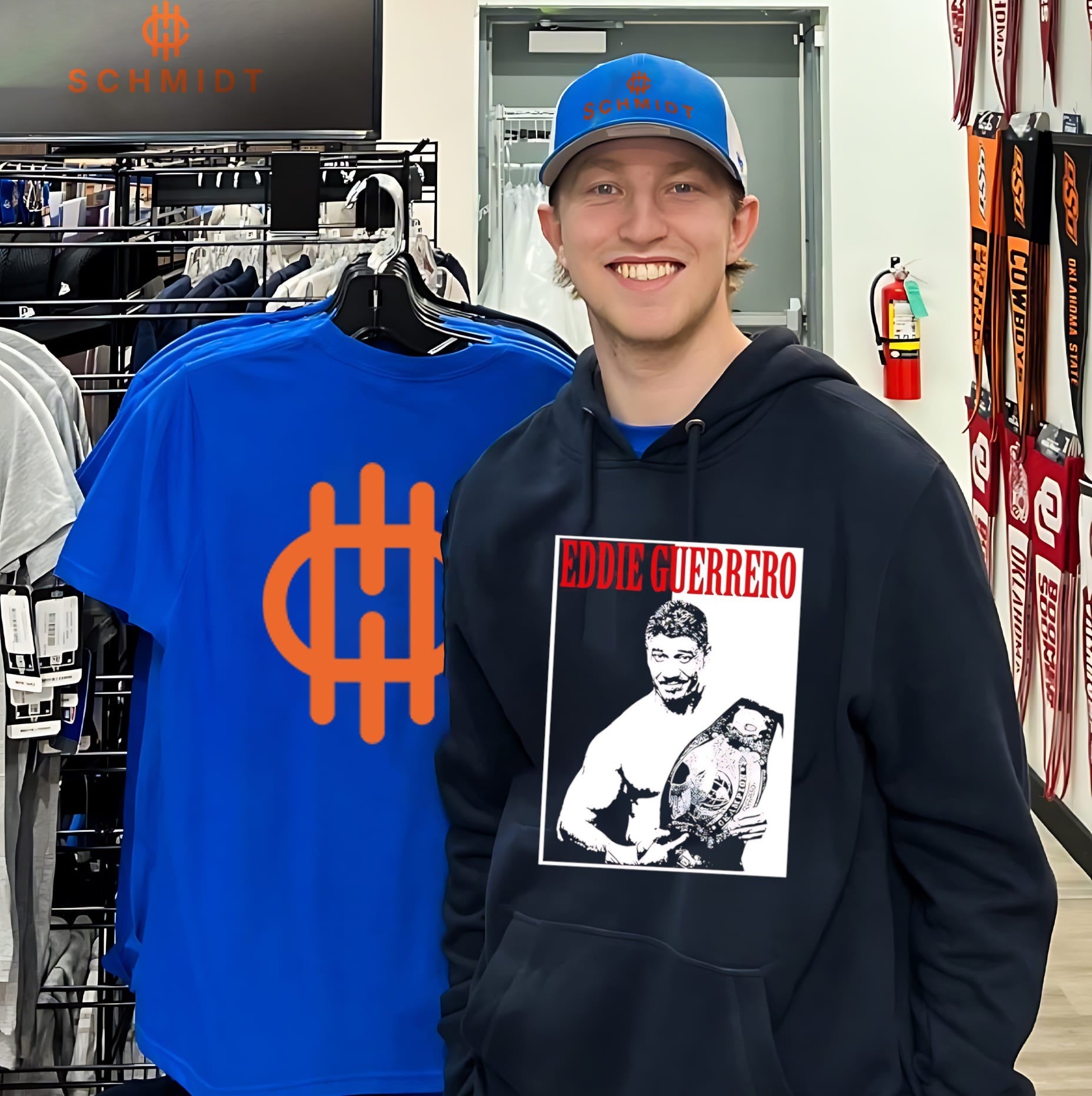 Eddie Guerrero holding championship belt shirt