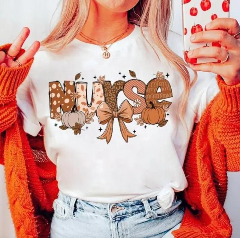 Fall Nurse Shirt or Sweatshirt, Autumn Pumpkin Bow Graphic Tee for Nurses, Cozy Thanksgiving Medical Top, Cute Seasonal...