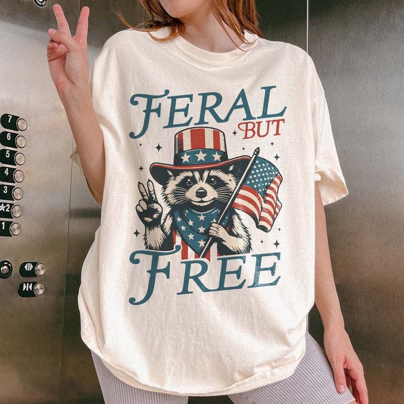 Funny 4th of July  Shirt, Feral But Free Fourth of July Shirt, Independence Day Shirt, Funny Raccoon Boys Tee Hoodie...