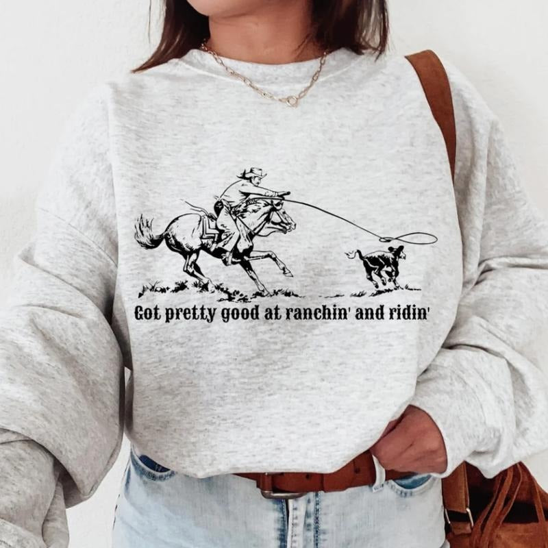 Got pretty good at Ranchin' And Ridin' Sweatshirt, Crewneck Graphic SweatShirt, cowgirl outfits, western outfit women,...