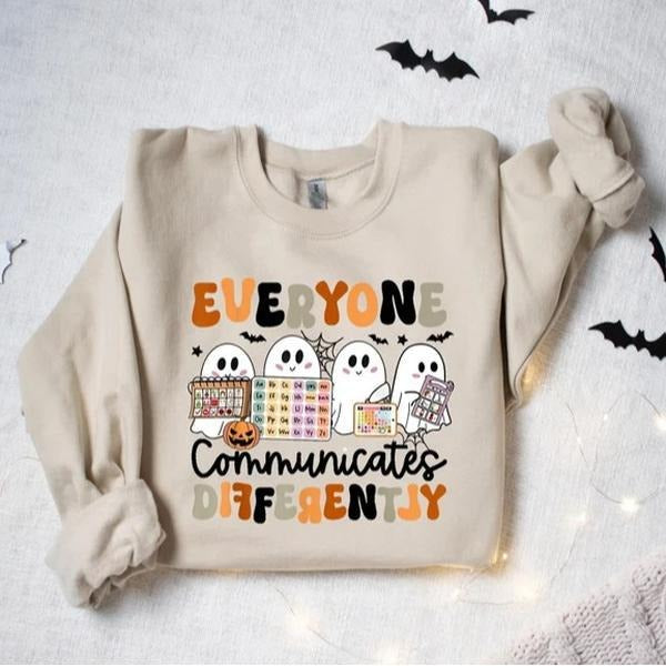 Halloween Everyone Communicates Differently Sweatshirt, Autism Awareness Teacher Halloween Shirt, Spooky Season Graphic...