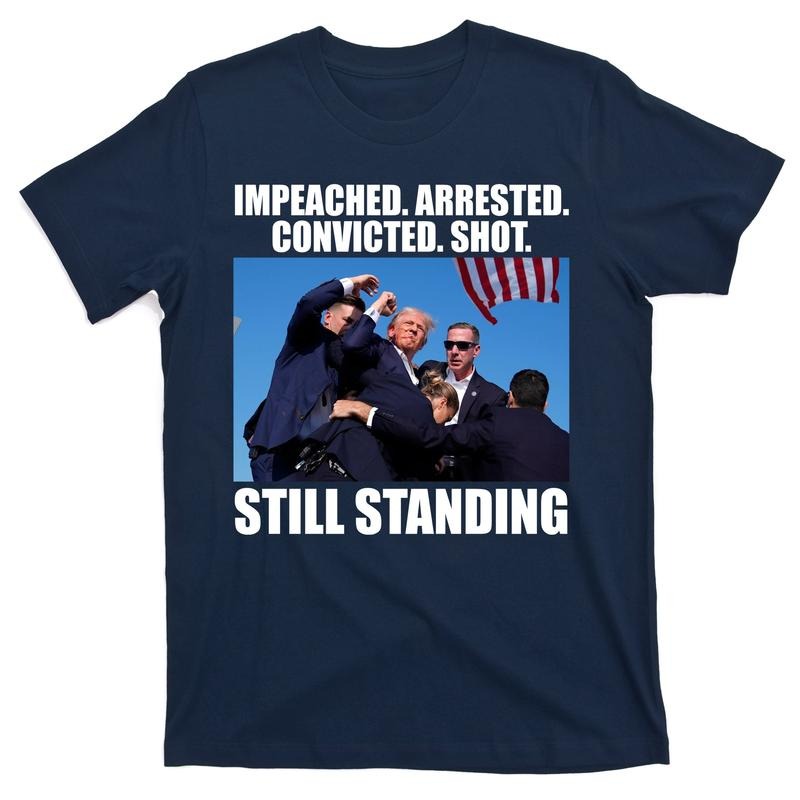 Impeached Arrested Convicted Shot Still Standing Donald Trump T-Shirt Hoodie Sweatshirt | PrintMintTees.com
