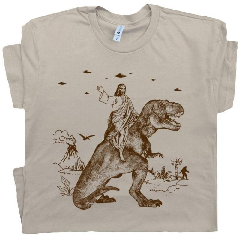 Jesus Riding Dinosaur T Shirt UFO T Shirt Funny T Shirts Cotton Menswear Top Polyester Hoodie Sweatshirt | PrintMintTees.com