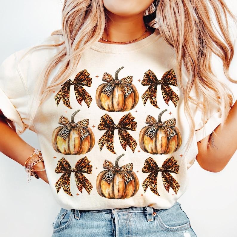 Leopard Pumpkin Coquette bow Shirt, retro halloween Shirt, trending Shirt, Fall bow Shirt soft girl Shirt, Pumpkin girly...