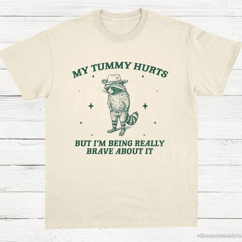 My Tummy Hurts But I'M Being Really Brave About Vintage Funny Raccoon Cowboy Meme Bandit Raccoon Menswear T-Shirts, Hoodie, Sweatshirt