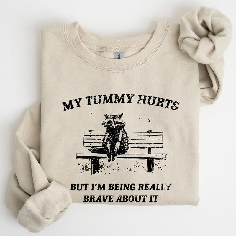 My Tummy Hurts, Raccoon, Meme, Aesthetic, Funny Sweatshirt, Women's Crew Neck, Crewneck T-Shirts, Hoodie | PrintMintTees.com