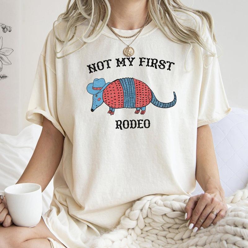 Not My First Rodeo Cowboy Armadillo Cute Crew Neck T-Shirts, Hoodie, Sweatshirt