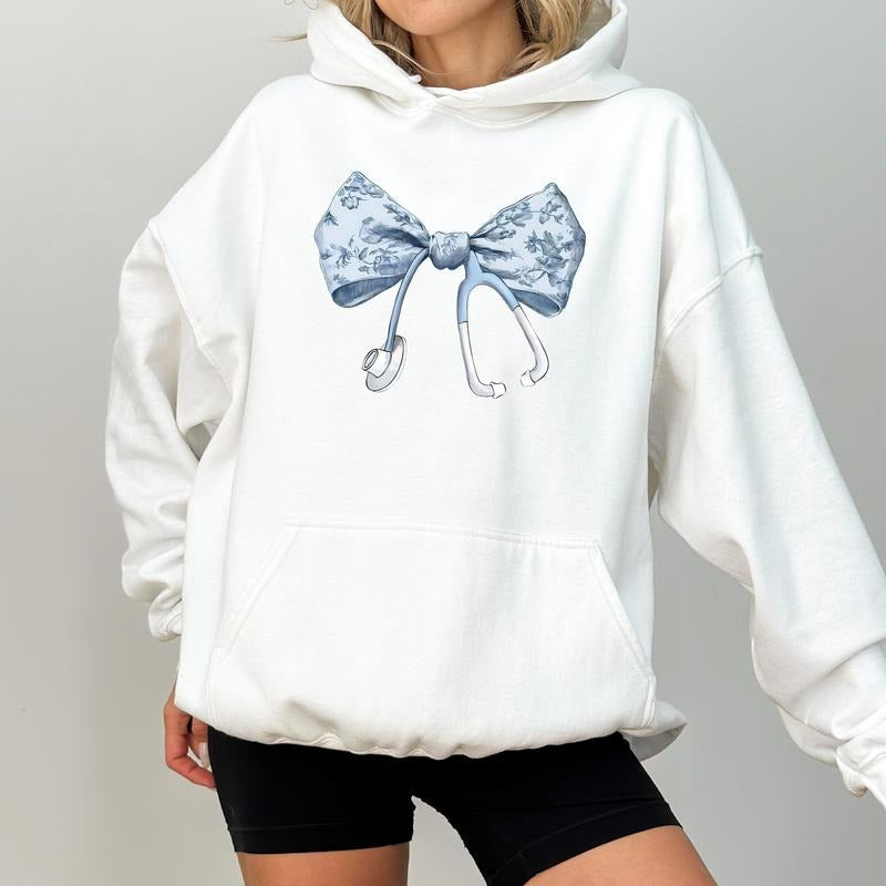Nurse Coquette Toile Bow Hoodie, Aesthetic Coquette Hoodies for Nurses, Vintage Toile De Jouy Bow Pullover, Cute Blue...
