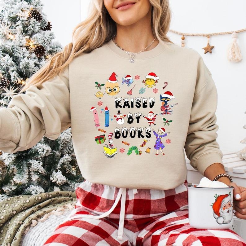 Raised By Books Christmas Sweatshirt, Pete The Cat Christmas T-shirt, Ms Frizzle Teacher Tee, Book Lover Gifts, Little...
