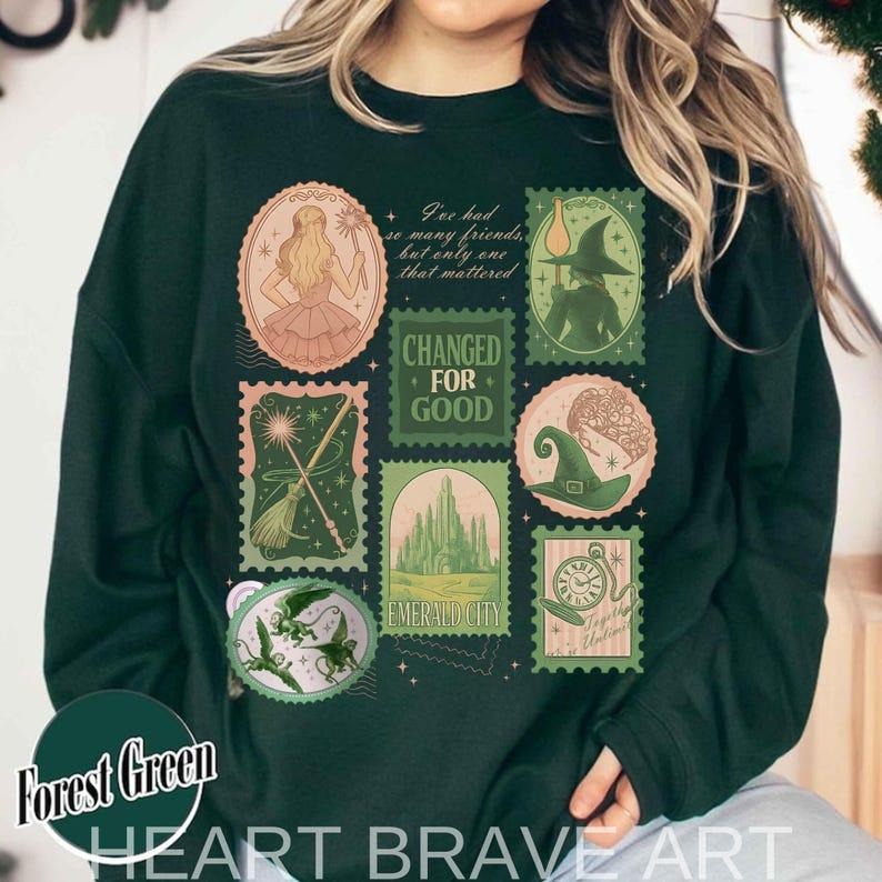 [ Sale Up To 40%] Wicked Changed For Good Stamps, Defy Gravity Broomstick Magic Wand, Wizard Movie Fan Sweatshirt Shirt...