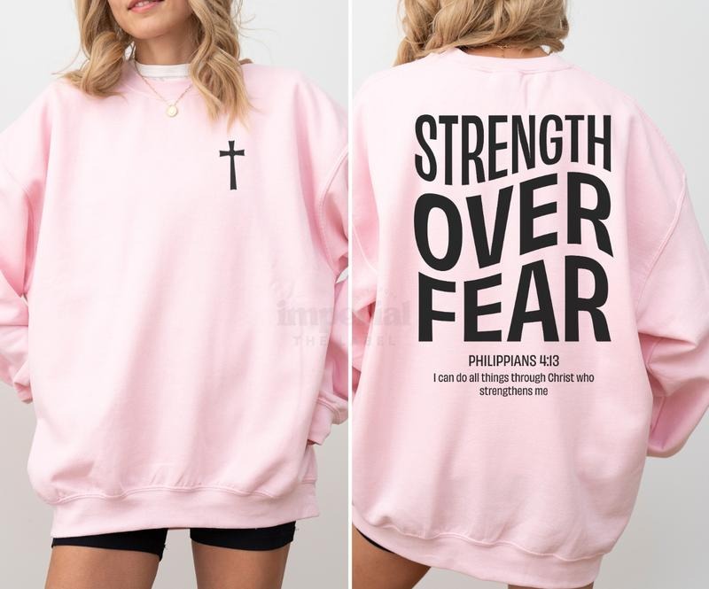 Strength Over Fear Sweatshirt, Must-Have Motivational Crewneck, Front and Back Statement Graphic, Cozy Unisex Streetwear,...