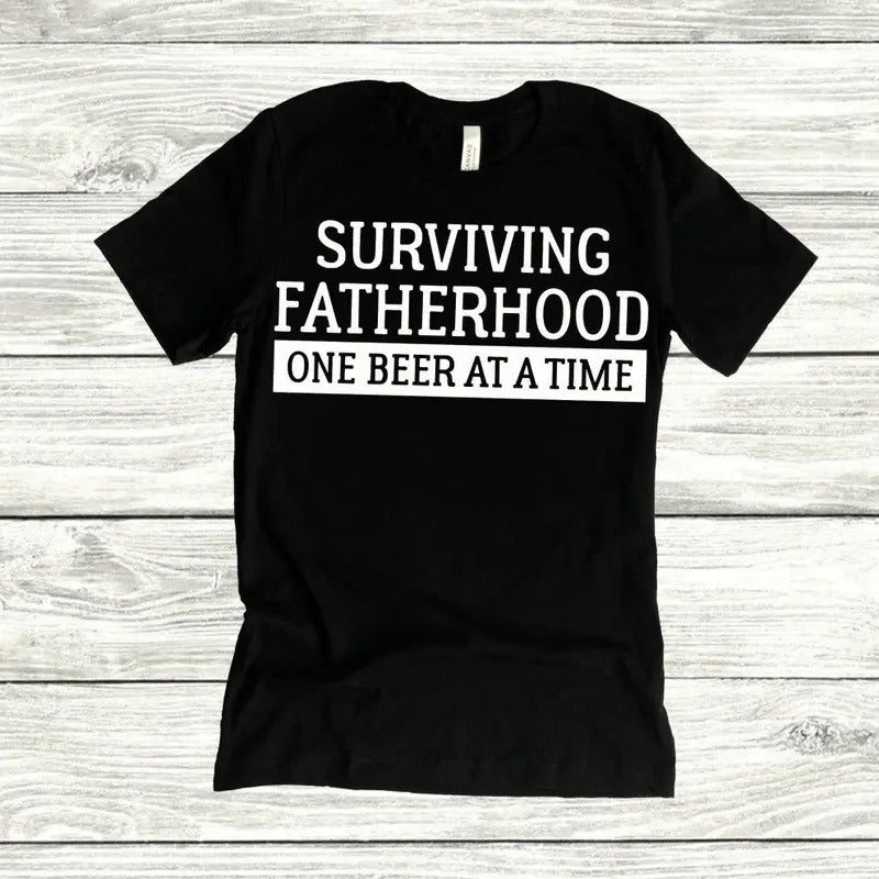 Surviving Fatherhood One Beer At A Time Shirt Father's Day Shirt Gift For Dad Dad Life Fatherhood Hoodie Sweatshirt
