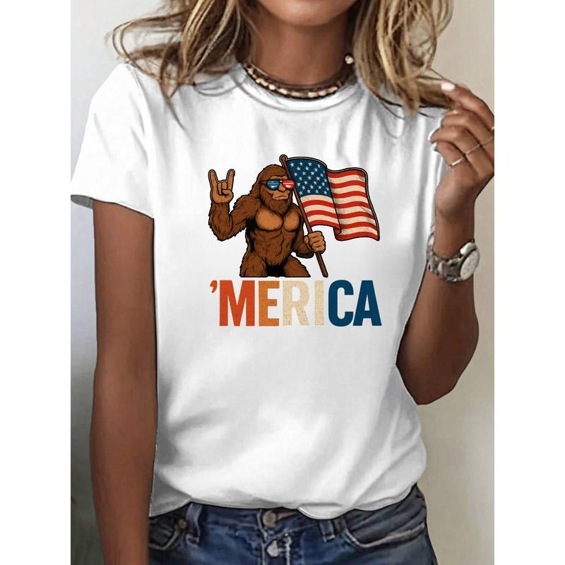 "Unique Women's T - Shirt Combining Fun and National Pride, Showcasing a Playful Bigfoot with an American Flag and a Catchy 'MERICA' Slogan"
