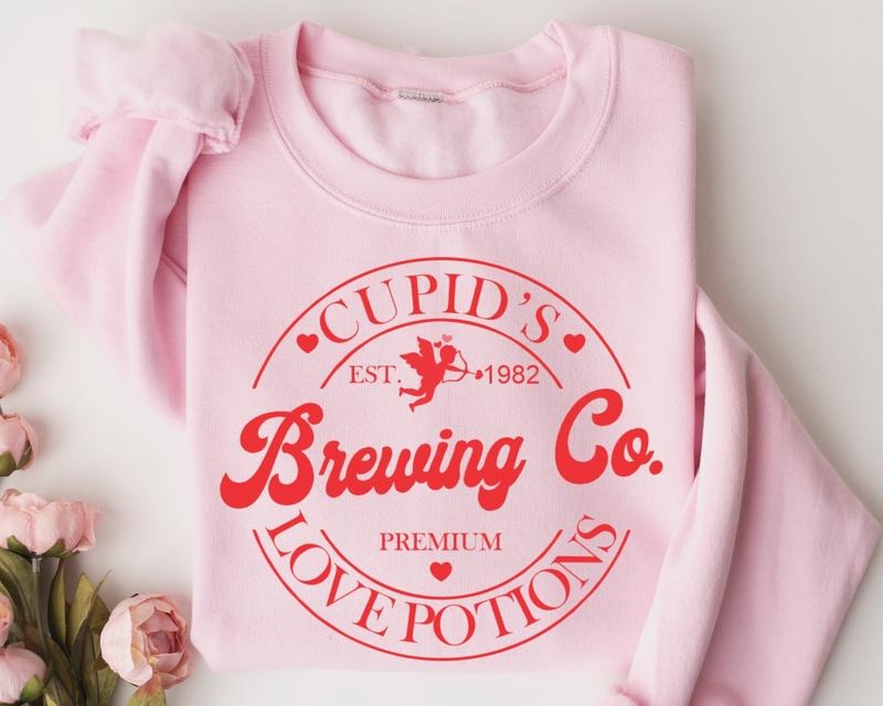Valentines Day Sweatshirt, Cupid's Brewing Co Premium Love Potions Est 1982 Shirt, Cupid Sweater, Cupid Premium Sweater,...