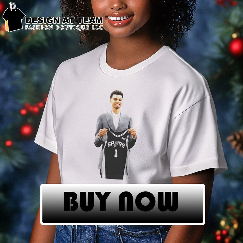Victor Wembanyama is holding 1 jersey for the San Antonio Spurs Basketball NBA 2026 shirt