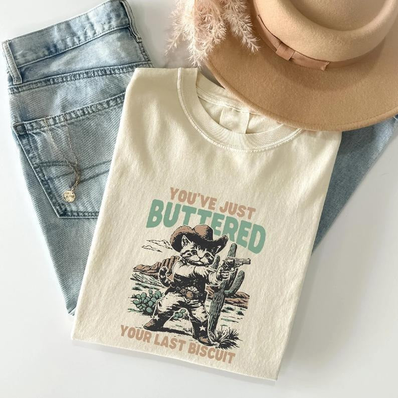 You'Ve Just Buttered Your Last Biscuit Shirt Western Cat Shirt Funny Cowboy Cat Yee'D Your Last Haw Cat T-Shirts, Hoodie, Sweatshirt
