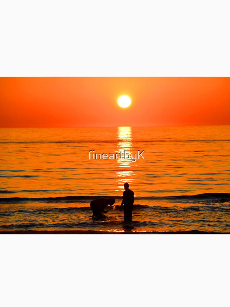 orange sunset ocean with two people by fineartbyK