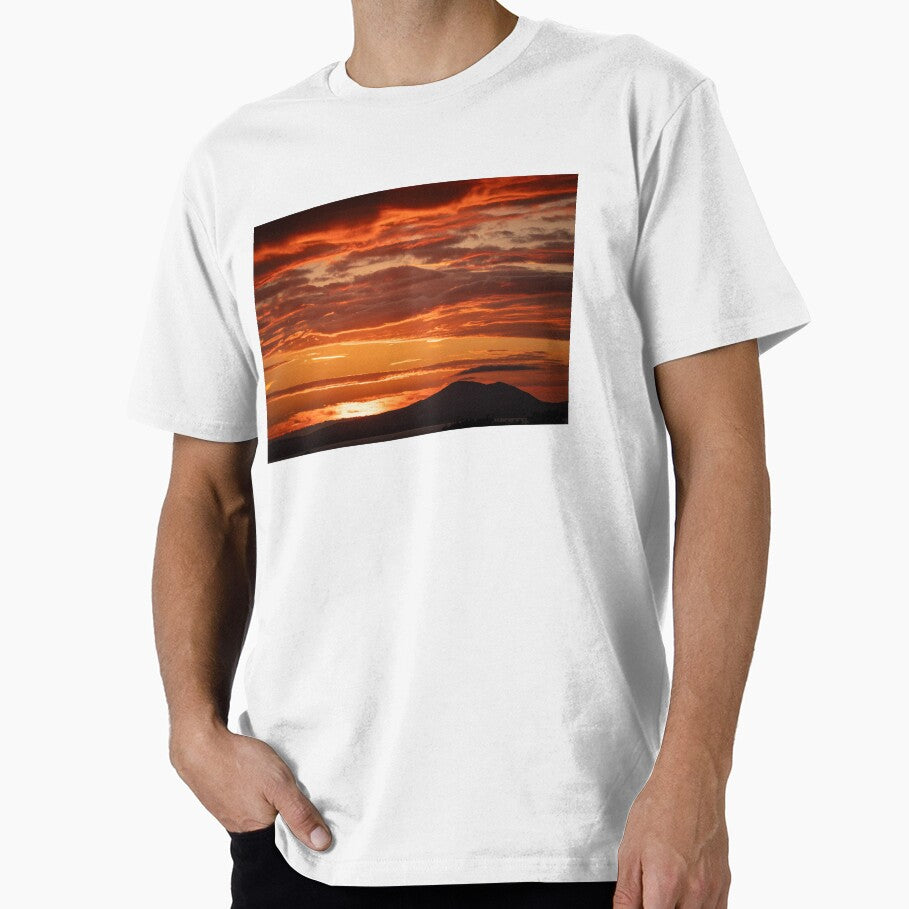 Glowing Orange Sunset With Clouds And Hills Silhouette by Harmony Of The Mind
