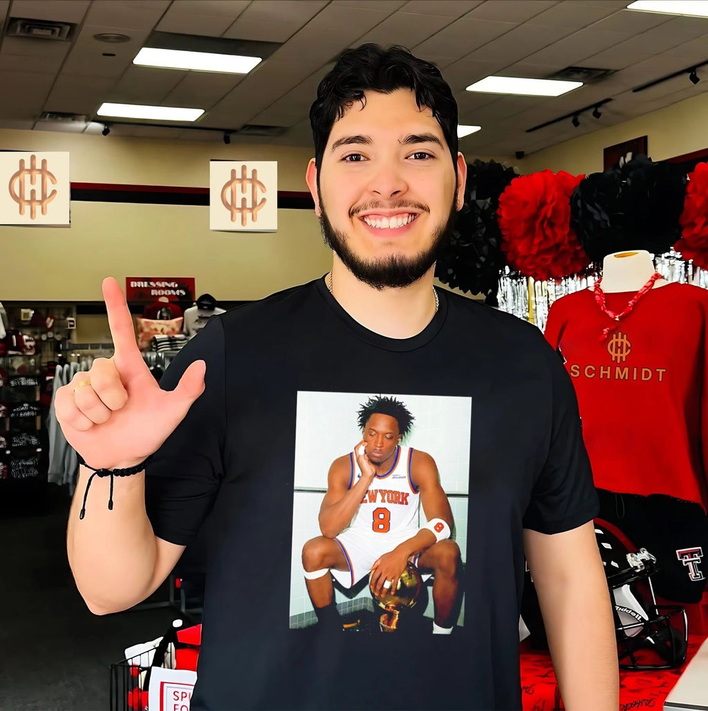 New York Knicks OG Anunoby sitting with trophy shirt